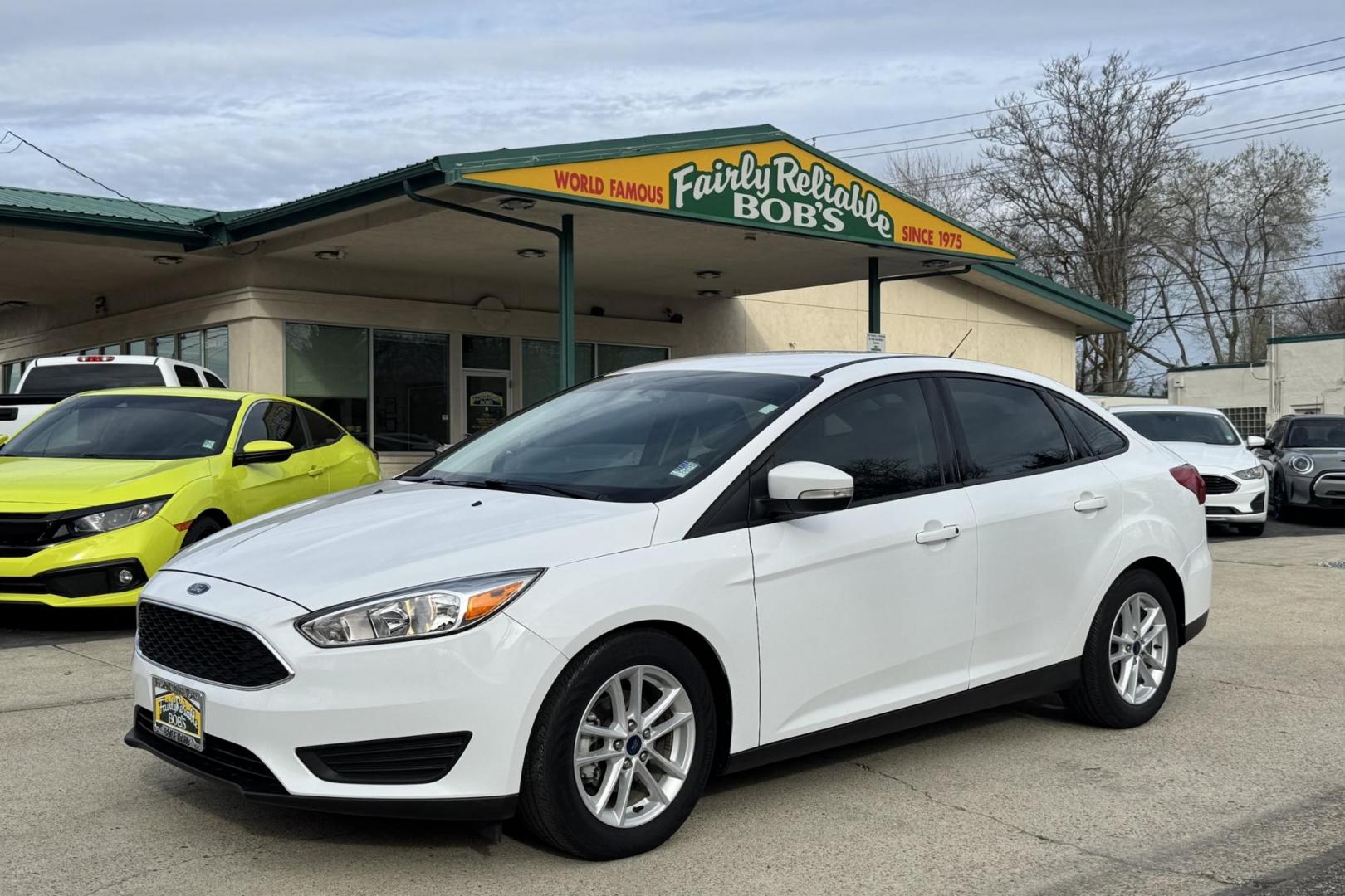 2017 Oxford White /Black Ford Focus SE (1FADP3F25HL) with an 4 Cyl 2.0 Liter engine, Automatic 6 Speed transmission, located at 2304 W. Main St., Boise, ID, 83702, (208) 342-7777, 43.622105, -116.218658 - Photo#0