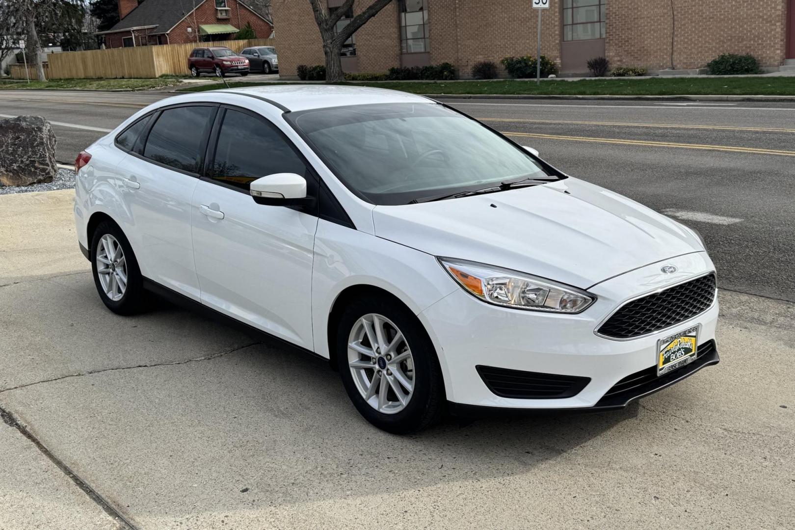 2017 Oxford White /Black Ford Focus SE (1FADP3F25HL) with an 4 Cyl 2.0 Liter engine, Automatic 6 Speed transmission, located at 2304 W. Main St., Boise, ID, 83702, (208) 342-7777, 43.622105, -116.218658 - Photo#2