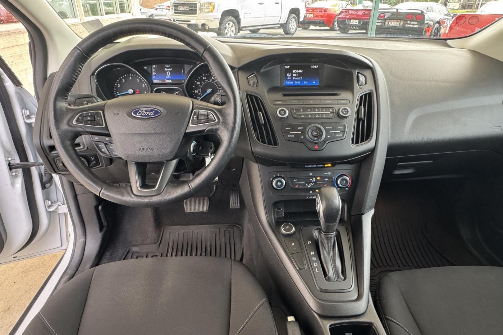 2017 Oxford White /Black Ford Focus SE (1FADP3F25HL) with an 4 Cyl 2.0 Liter engine, Automatic 6 Speed transmission, located at 2304 W. Main St., Boise, ID, 83702, (208) 342-7777, 43.622105, -116.218658 - Photo#7