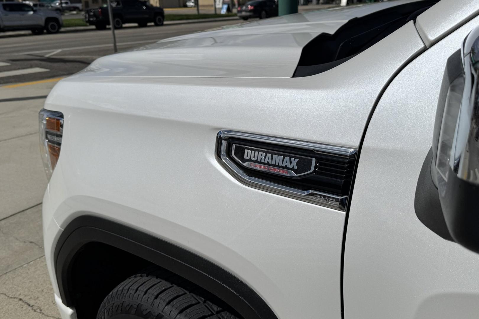 2022 White /Tobacco GMC Sierra Denali (1GTU9FET4NZ) with an 6 Cyl 3.0 Liter Duramax Turbo Diesel engine, Automatic 10 Speed transmission, located at 2304 W. Main St., Boise, ID, 83702, (208) 342-7777, 43.622105, -116.218658 - Duramax Powered Denali! New Tires And Ready To Go! - Photo#1