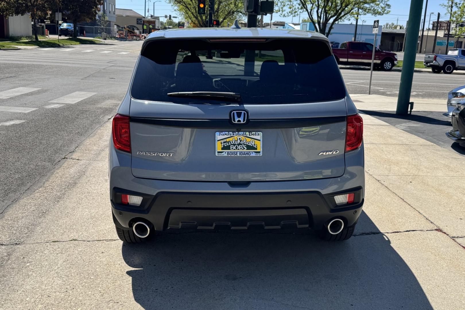 2023 Sonic Gray /Black Honda Passport EX-L HPD (5FNYF8H57PB) with an V6 3.5 Liter engine, Automatic 9 Speed transmission, located at 2304 W. Main St., Boise, ID, 83702, (208) 342-7777, 43.622105, -116.218658 - Honda Performance Development Package! Low Mileage And Clean! - Photo#1