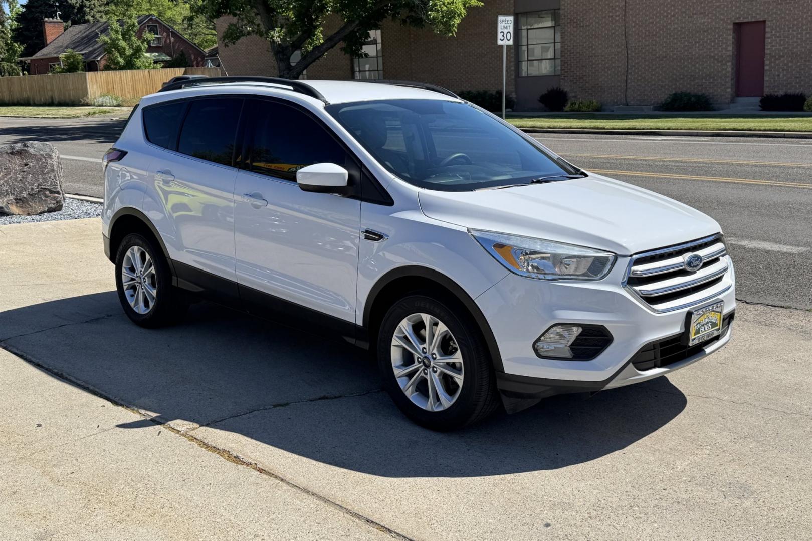 2018 Oxford White /Gray Ford Escape SE (1FMCU9GD1JU) with an 4 Cyl 1.5 Liter Turbo engine, Automatic 6 Speed transmission, located at 2304 W. Main St., Boise, ID, 83702, (208) 342-7777, 43.622105, -116.218658 - New Tires! Low Mileage! Heated Seats! Ready To Go! - Photo#2