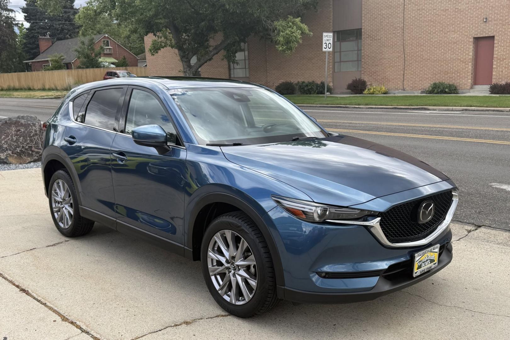 2019 Eternal Blue Mica /Black Mazda CX-5 Grand Touring (JM3KFBDM5K1) with an 4 Cyl 2.5 Liter engine, Automatic 6 Speed transmission, located at 2304 W. Main St., Boise, ID, 83702, (208) 342-7777, 43.622105, -116.218658 - GT Premium Package! All Wheel Drive! Apple Car Play/Android Auto! Clean Car! - Photo#2