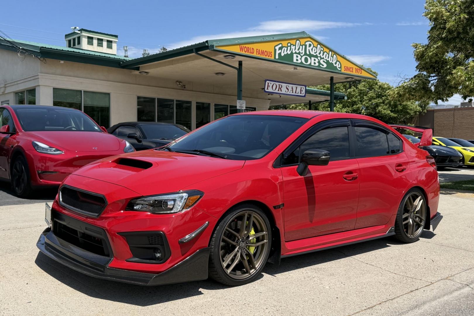 2018 Pure Red /Black/Red Subaru WRX STi (JF1VA2N67J9) with an H4 2.5 Liter Turbo engine, 6 Speed transmission, located at 2304 W. Main St., Boise, ID, 83702, (208) 342-7777, 43.622105, -116.218658 - Stunning WRX STi !- Photo#0