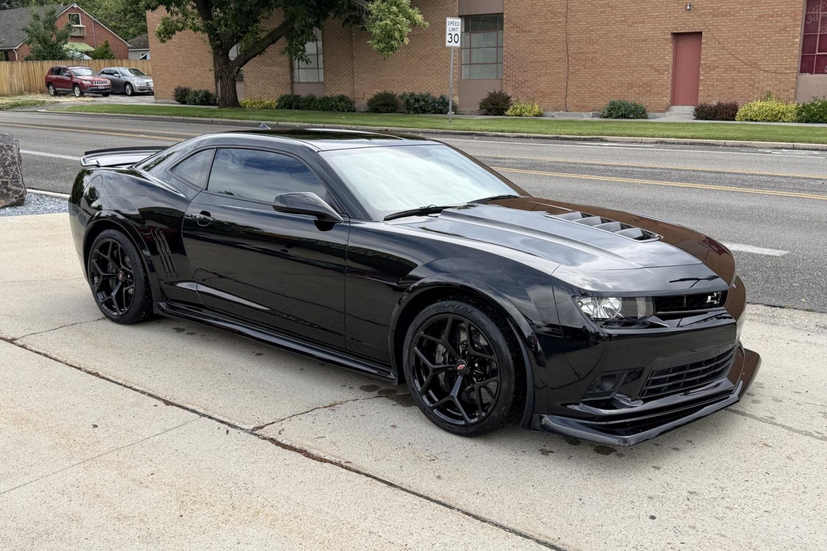 2014 Black /Black Chevrolet Camaro Z/28 (2G1FS1EE3E9) with an V8 7.0 Liter LS7 engine, 6 Speed Manual transmission, located at 2304 W. Main St., Boise, ID, 83702, (208) 342-7777, 43.622105, -116.218658 - The 2014 Chevrolet Camaro Z/28 is a track-focused, bare-bones supercar-killer. Powered by a 505-hp 7.0-liter LS7 V8. Raw, analog performance, Multimatic DSSV dampers, massive carbon-ceramic brakes, and extreme grip. This is a drivers car!- Photo#2