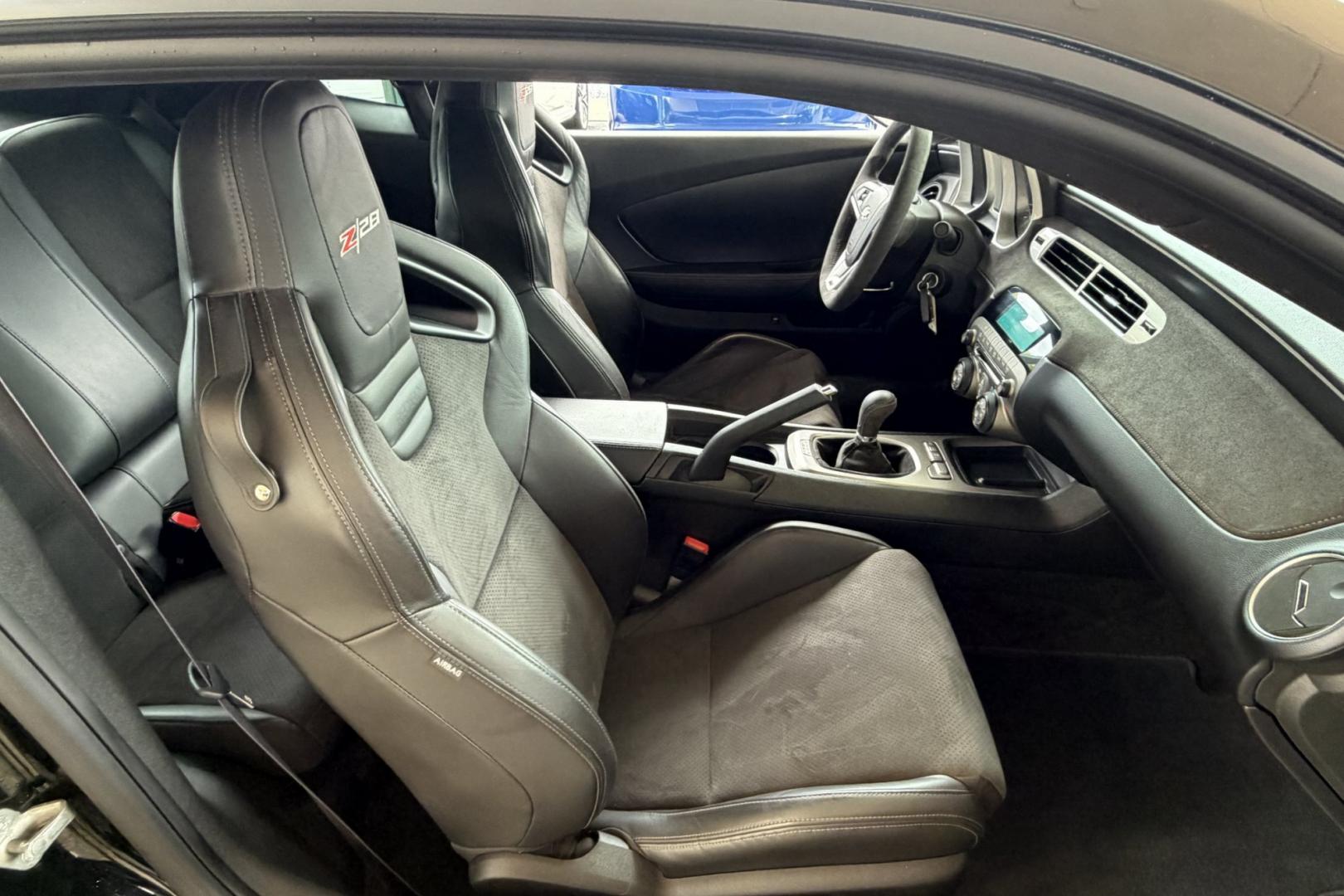 2014 Black /Black Chevrolet Camaro Z/28 (2G1FS1EE3E9) with an V8 7.0 Liter LS7 engine, 6 Speed Manual transmission, located at 2304 W. Main St., Boise, ID, 83702, (208) 342-7777, 43.622105, -116.218658 - The 2014 Chevrolet Camaro Z/28 is a track-focused, bare-bones supercar-killer. Powered by a 505-hp 7.0-liter LS7 V8. Raw, analog performance, Multimatic DSSV dampers, massive carbon-ceramic brakes, and extreme grip. This is a drivers car!- Photo#10