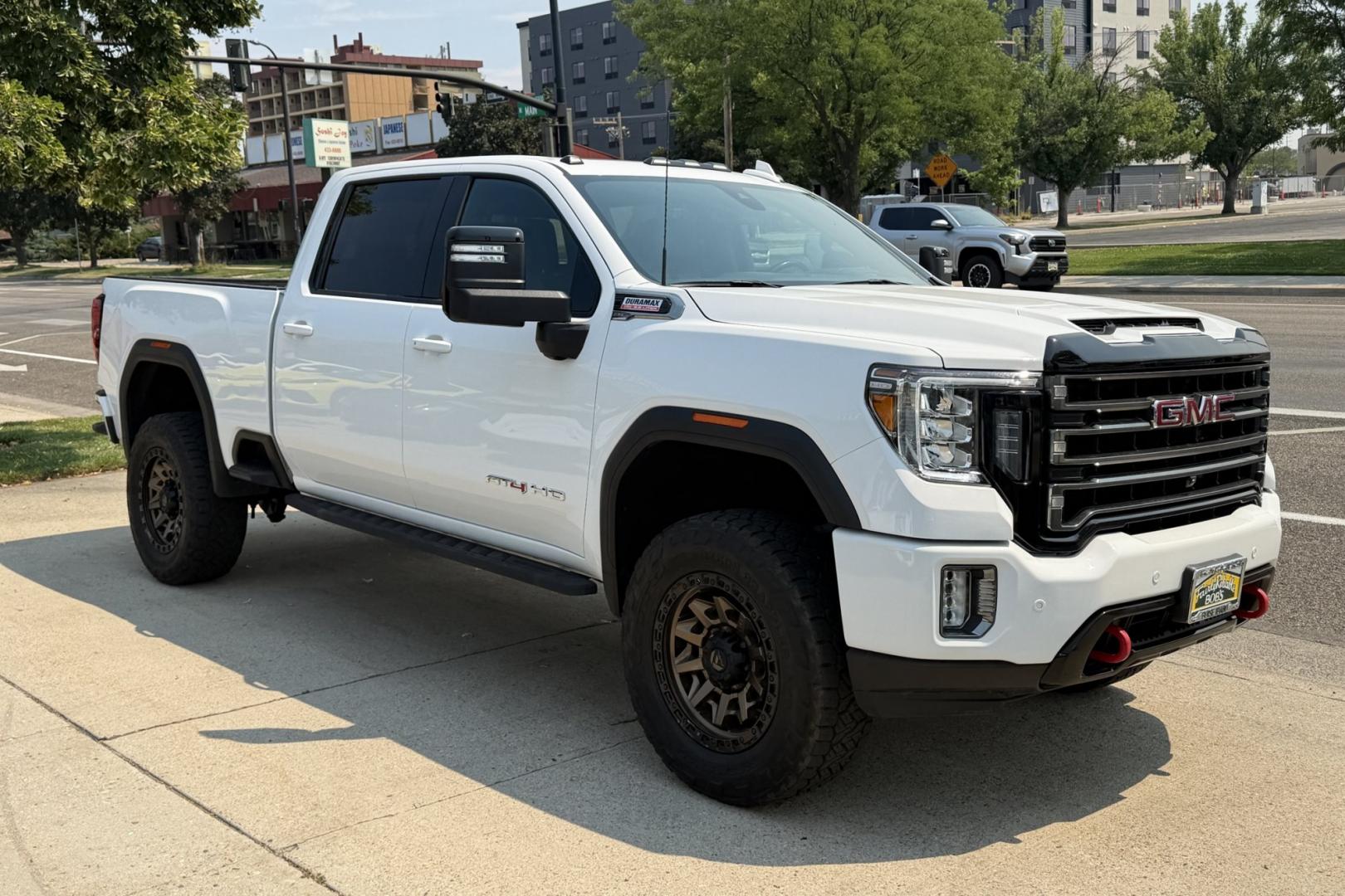2021 White /Black GMC Sierra 3500HD AT4 (1GT49VEYXMF) with an V8 6.6 Liter Duramax Turbo Diesel engine, Automatic Allison 10 Speed transmission, located at 2304 W. Main St., Boise, ID, 83702, (208) 342-7777, 43.622105, -116.218658 - Looking For A Great Truck? This Is It!- Photo#3