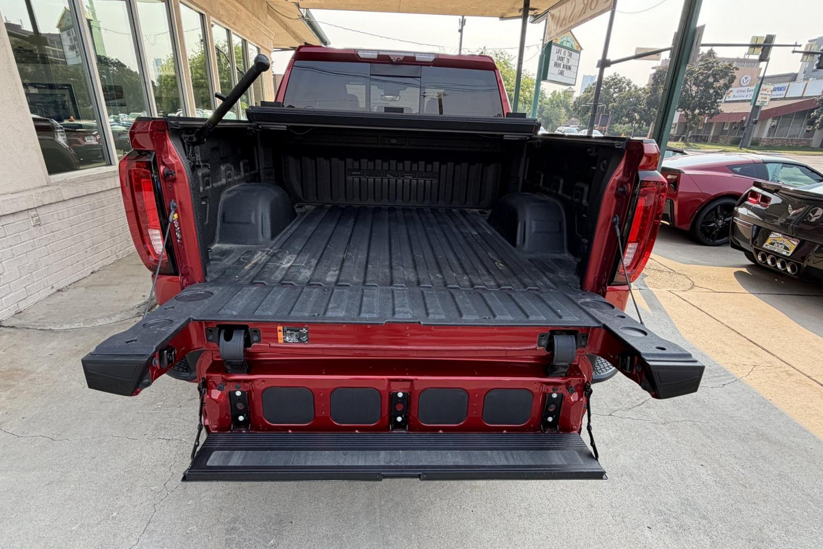 2023 Volcanic Red Tintcoat /Atmosphere/Brownstone GMC Sierra 1500 Denali (3GTUUGE81PG) with an 6 Cyl 3.0 Liter Duramax Turbo Diesel engine, Automatic 10 Speed transmission, located at 2304 W. Main St., Boise, ID, 83702, (208) 342-7777, 43.622105, -116.218658 - Clean, Low Mileage And Stunning! Power Running Boards Too!- Photo#36