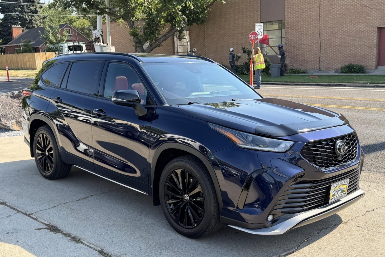 2023 Dark Blue Pearl /Red/Black Toyota Highlander XSE (5TDKDRBH9PS) with an 4 Cyl 2.4 Liter Turbo engine, Automatic 8 Speed transmission, located at 2304 W. Main St., Boise, ID, 83702, (208) 342-7777, 43.622105, -116.218658 - Highly Optioned, 7 Passenger And Clean!- Photo#2