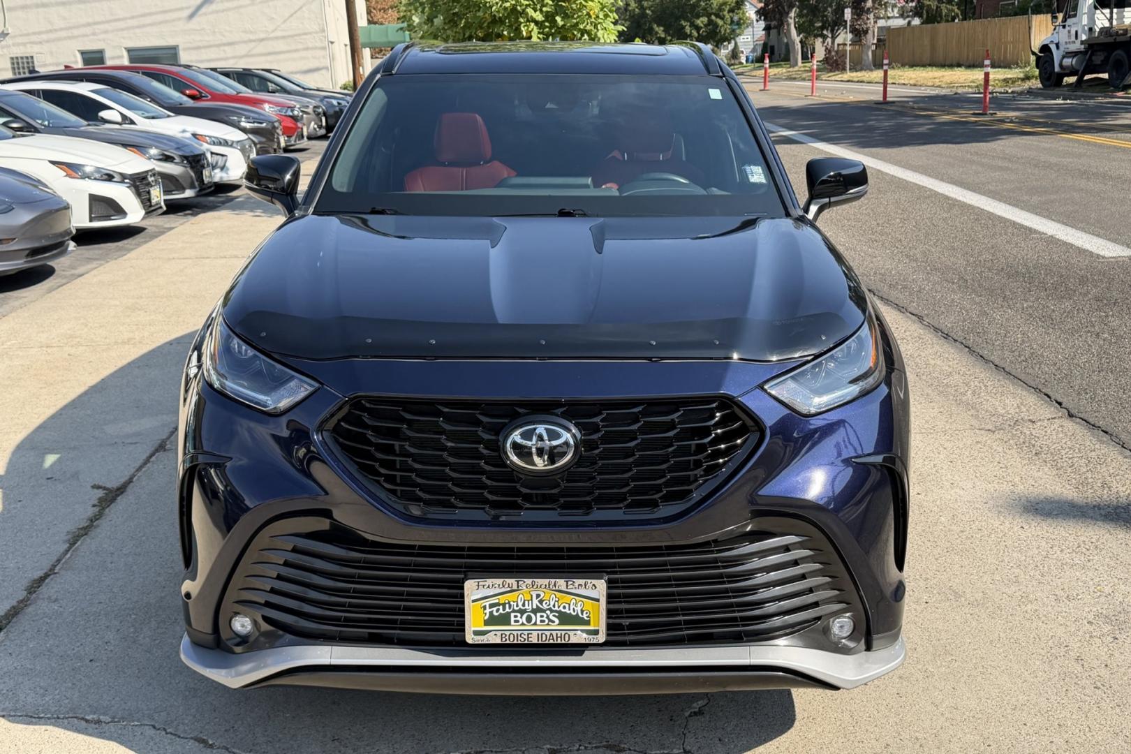 2023 Dark Blue Pearl /Red/Black Toyota Highlander XSE (5TDKDRBH9PS) with an 4 Cyl 2.4 Liter Turbo engine, Automatic 8 Speed transmission, located at 2304 W. Main St., Boise, ID, 83702, (208) 342-7777, 43.622105, -116.218658 - Highly Optioned, 7 Passenger And Clean!- Photo#3