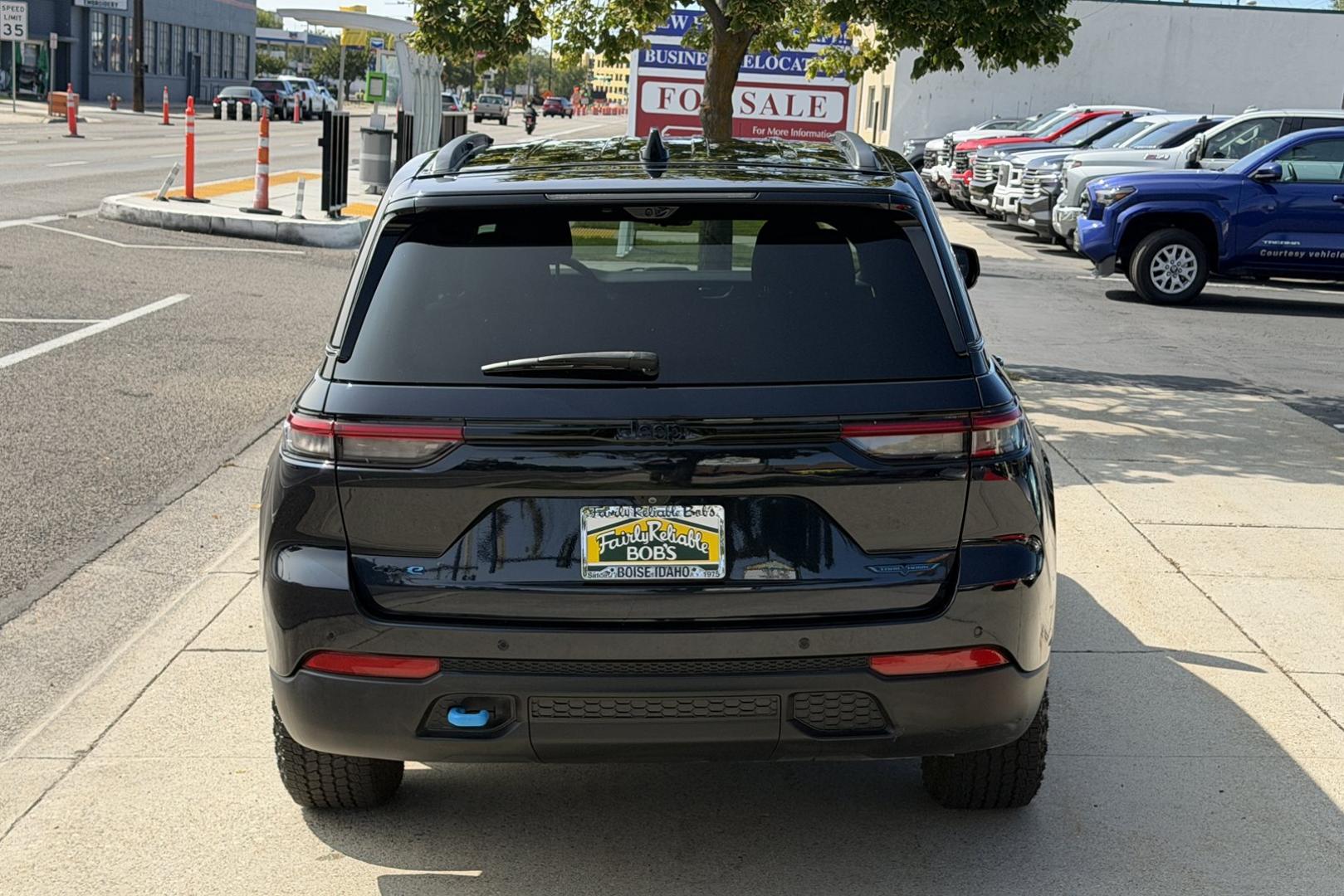 2023 Midnight Sky Metallic /Black Jeep Grand Cherokee Trailhawk (1C4RJYC62P8) with an 4 Cyl 2.0 Liter Turbo Hybrid engine, Automatic 8 Speed transmission, located at 2304 W. Main St., Boise, ID, 83702, (208) 342-7777, 43.622105, -116.218658 - Smooth Ride! Highly Optioned! Great Safety Ratings And Fuel Economy Too!- Photo#1