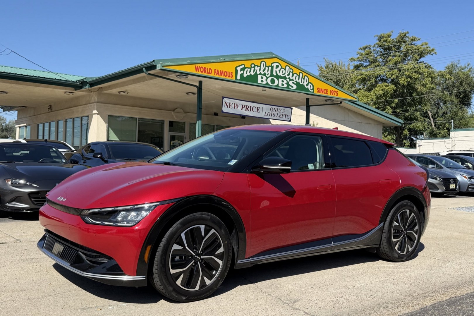 2023 Runaway Red /Black Kia EV6 Wind (KNDC3DLC1P5) with an 77.4 kWh engine, Automatic transmission, located at 2304 W. Main St., Boise, ID, 83702, (208) 342-7777, 43.622105, -116.218658 - 282 Miles of Range! All Wheel Drive! High Marks In Safety Too!- Photo#0