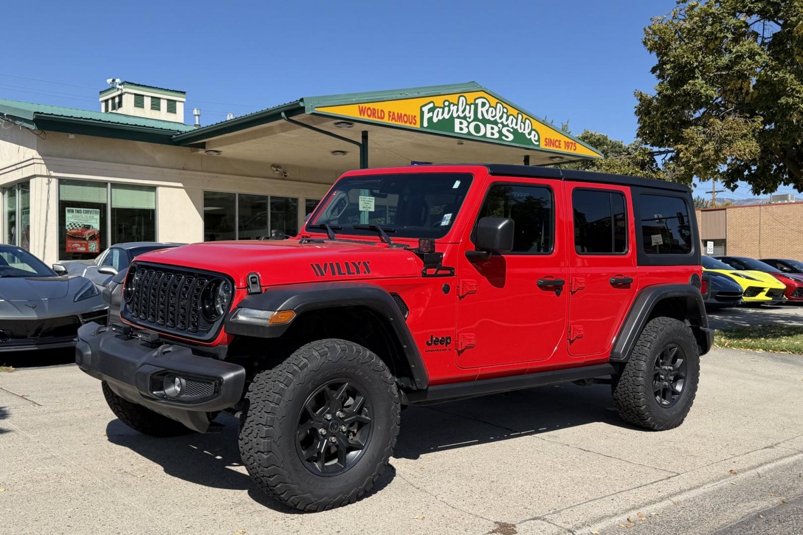 2024 Firecracker Red /Black Jeep Wrangler Unlimited Willys (1C4PJXDG7RW) with an V6 3.6 Liter engine, 6 Speed Manual transmission, located at 2304 W. Main St., Boise, ID, 83702, (208) 342-7777, 43.622105, -116.218658 - Manual Transmission Jeep Wrangler Unlimited Willys! Ready For Adventure!- Photo#0