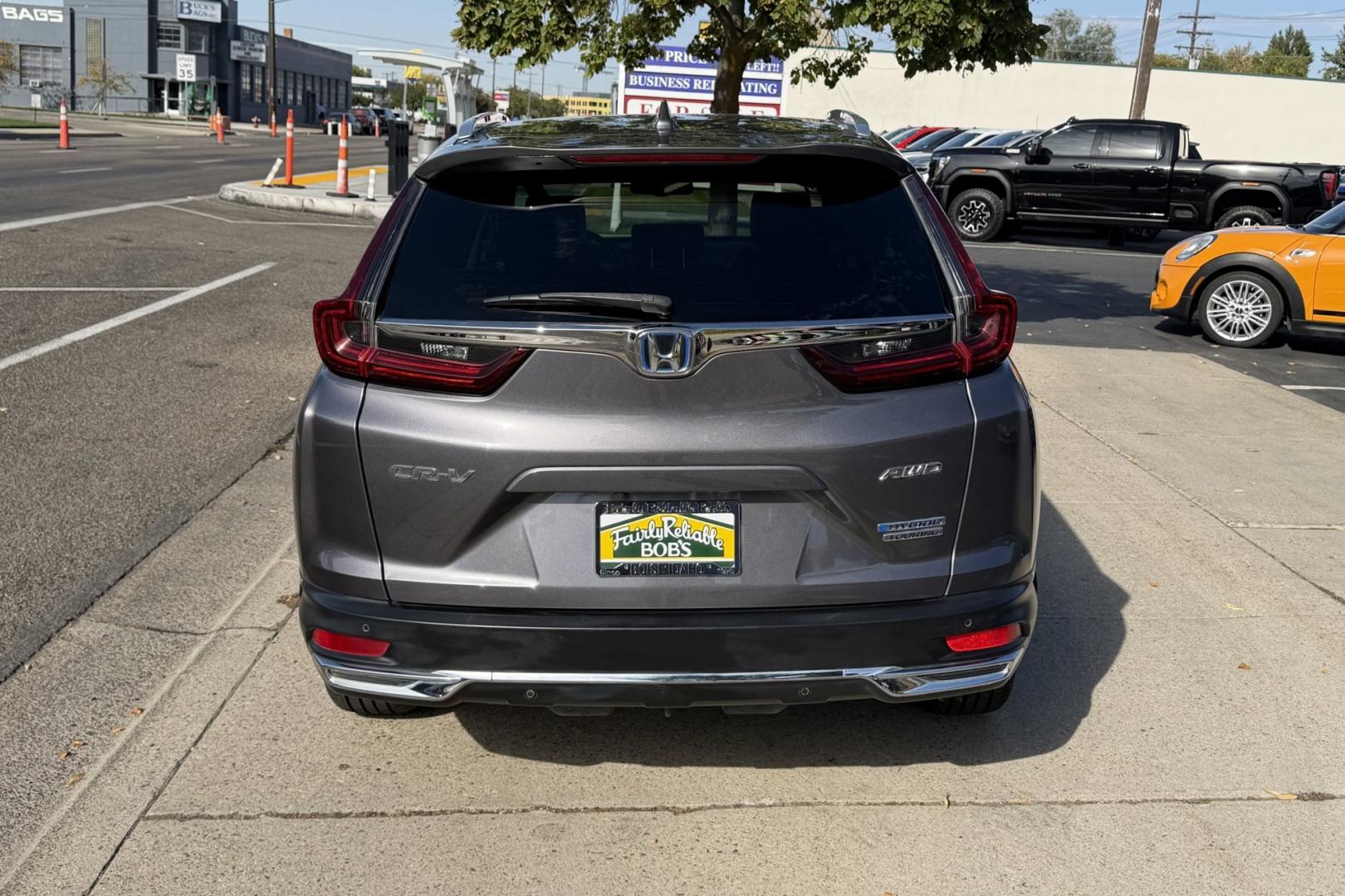 2021 Modern Steel Metallic /Black Honda CR-V Hybrid Touring (7FART6H90ME) with an 4 Cyl 2.0 Liter Hybrid engine, Automatic transmission, located at 2304 W. Main St., Boise, ID, 83702, (208) 342-7777, 43.622105, -116.218658 - Hard To Find! Great To Own! New Tires Too!- Photo#1