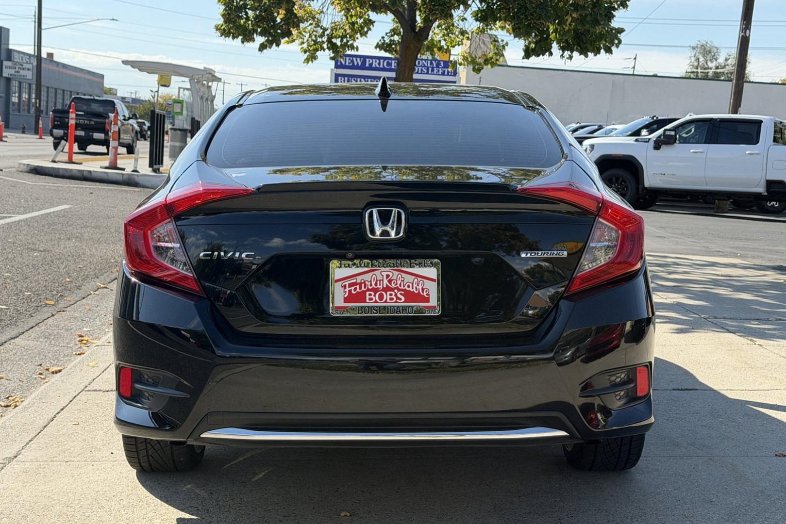2019 Crystal Black Pearl /Black Honda Civic Touring (JHMFC1F99KX) with an 4 Cyl 1.5 Liter Turbo engine, Automatic transmission, located at 2304 W. Main St., Boise, ID, 83702, (208) 342-7777, 43.622105, -116.218658 - Highly Optioned! Clean Civic Touring!- Photo#1