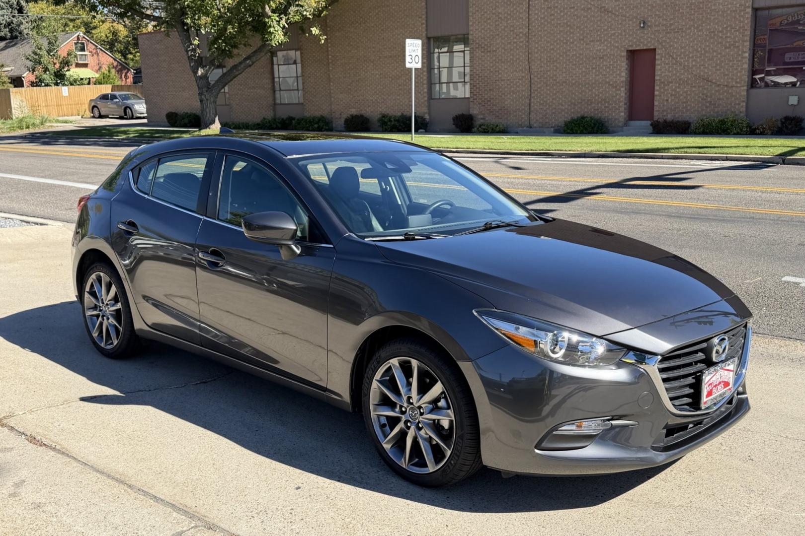 2018 Machine Gray Metallic /Black Mazda Mazda3 Touring (3MZBN1L3XJM) with an 4 Cyl 2.5 Liter engine, Automatic 6 Speed transmission, located at 2304 W. Main St., Boise, ID, 83702, (208) 342-7777, 43.622105, -116.218658 - Low Mileage! Sunroof! Heated Seats And Great Fuel Economy Too!- Photo#2