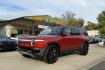 2024 Red Canyon /Shale Rivian Adventure Adventure (7PDSGBBA2RN) with an 135 kWh engine, Automatic transmission, located at 2304 W. Main St., Boise, ID, 83702, (208) 342-7777, 43.622105, -116.218658 - Stunning Rivian! Over 350 Miles of Range via EPA estimates. A lot of remaining factory warranty! Great Value!- Photo#0